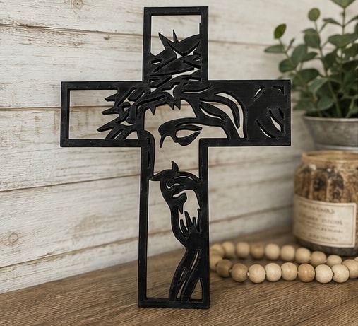 Black metal cross with Jesus face silhouette
