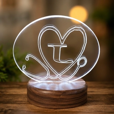 Neon heart letter L on wooden base