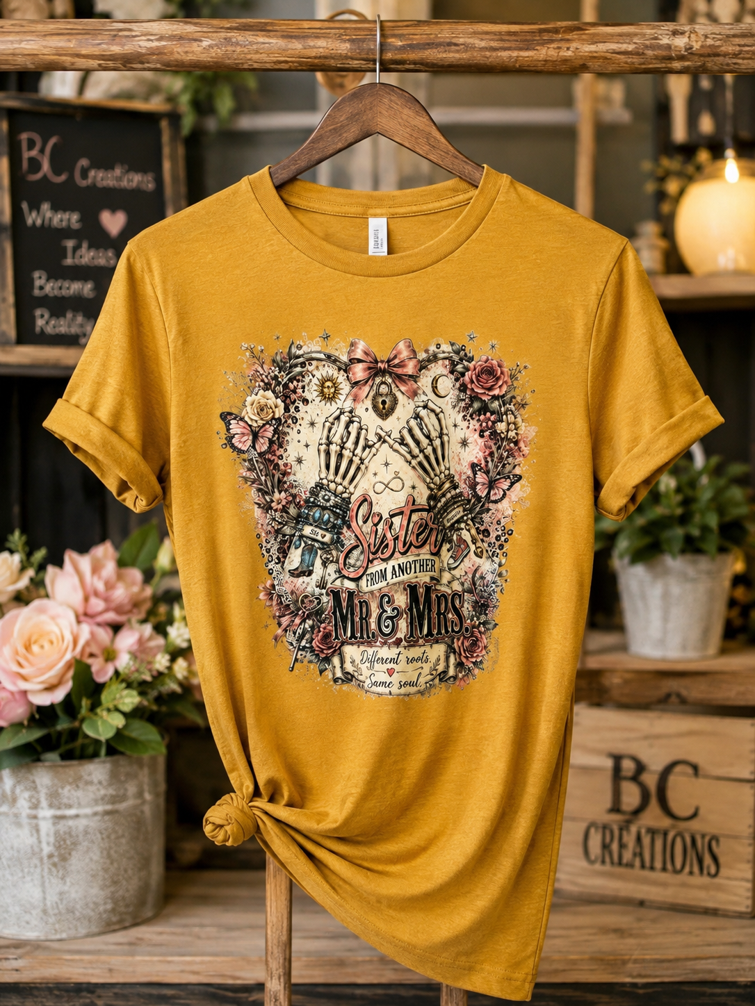 Mustard yellow graphic tee with floral design